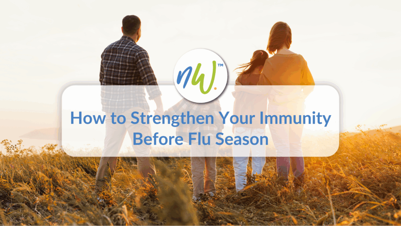 Couple walking through a fall field with text overlay “How to Strengthen Your Immunity Before Flu Season.”