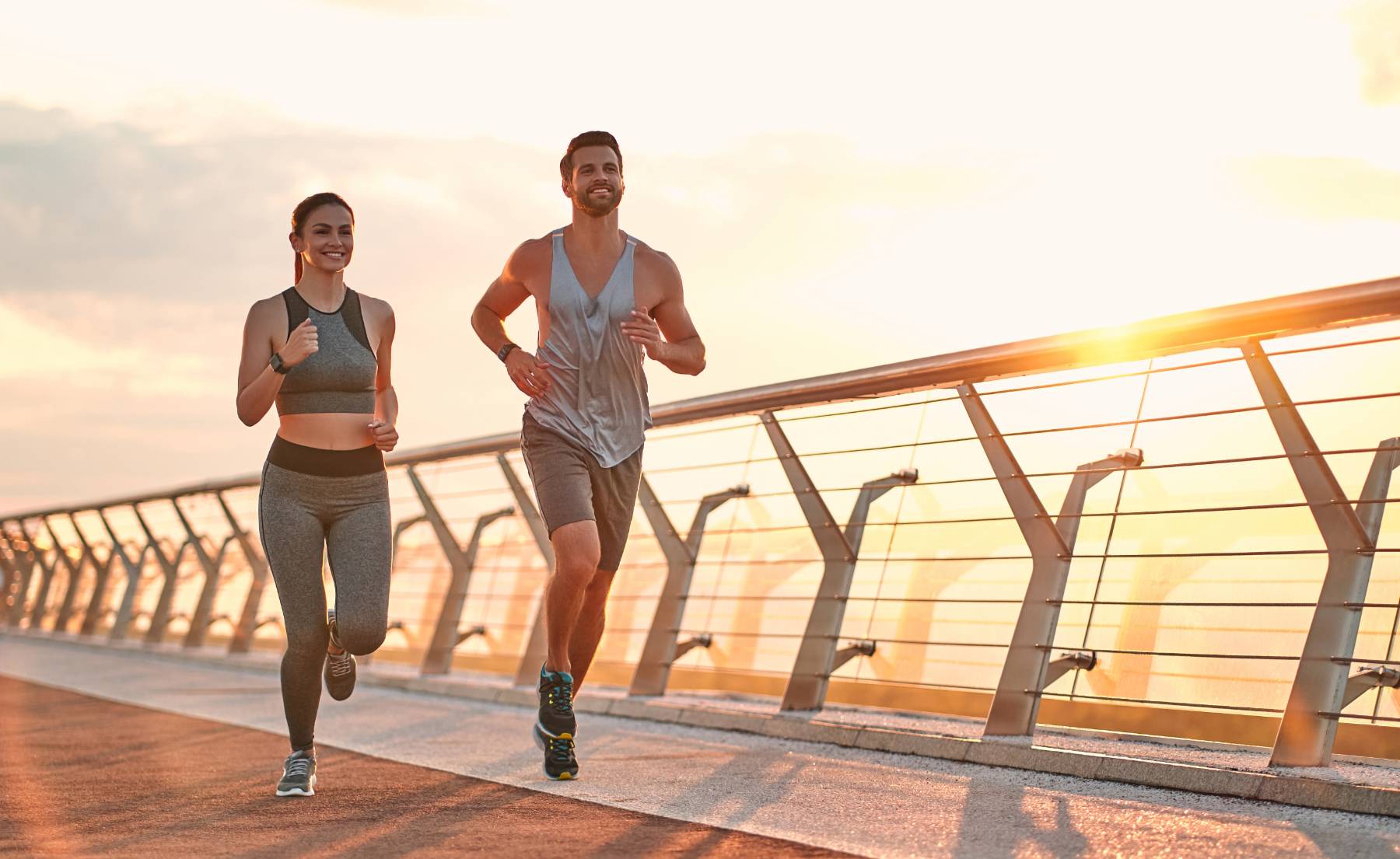 A healthy couple jogging outdoors, representing wellness with netWell.